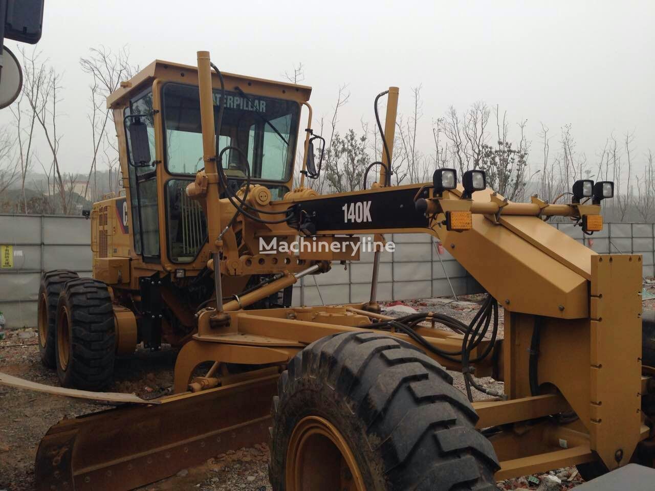 грейдер Caterpillar 140K